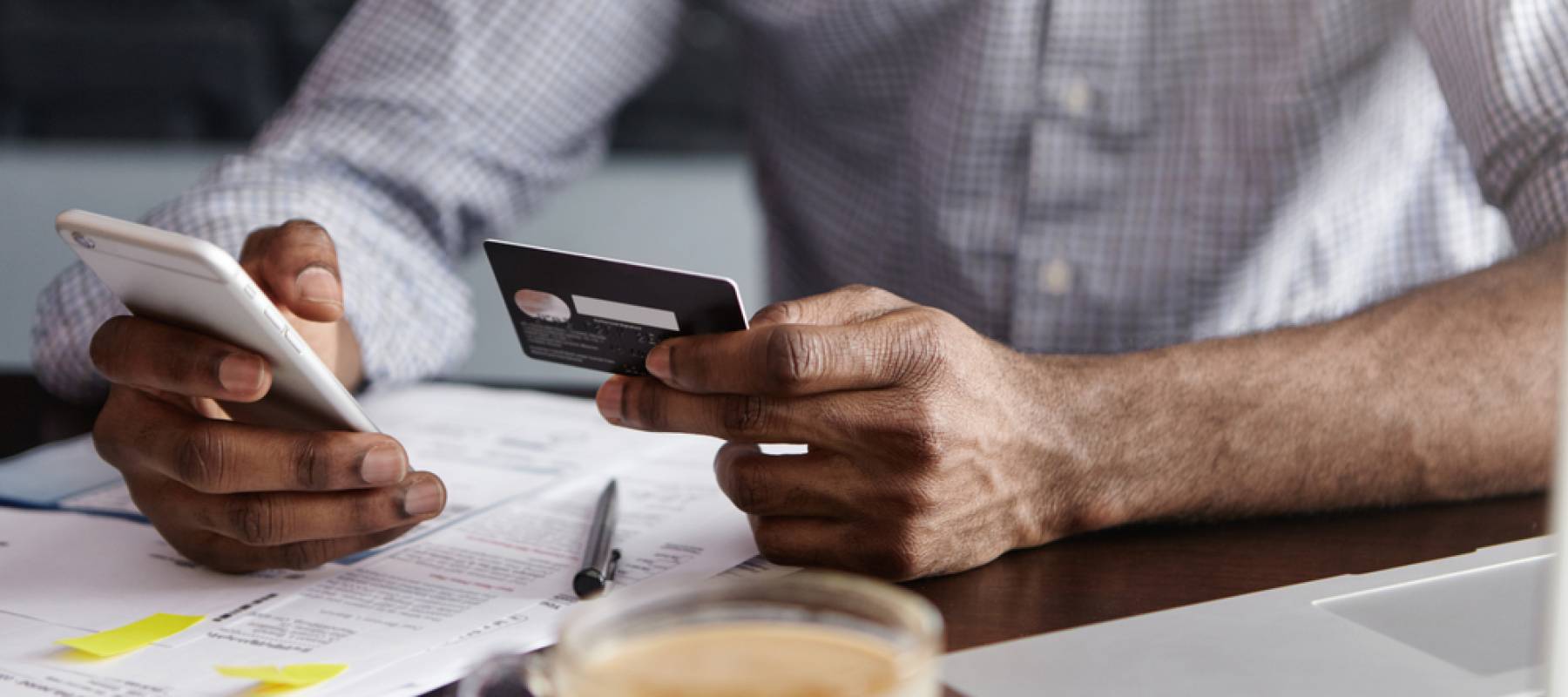 Man holding a bank card.