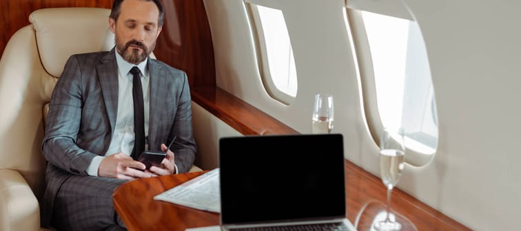 Wealthy businessman on a private jet.