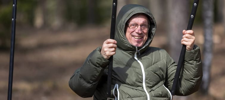 A man swinging at a playground.